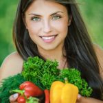 woman holding organic vegetables